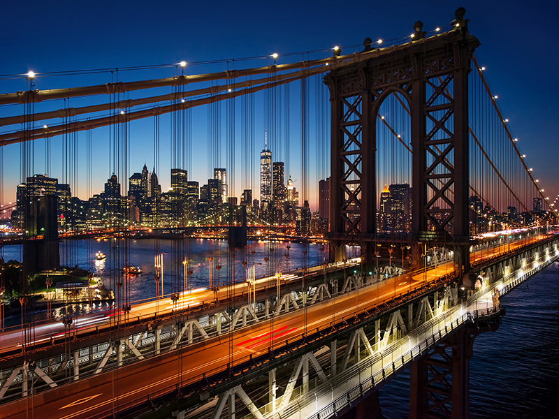 New York City - beautiful sunset over manhattan with manhattan and brooklyn bridge