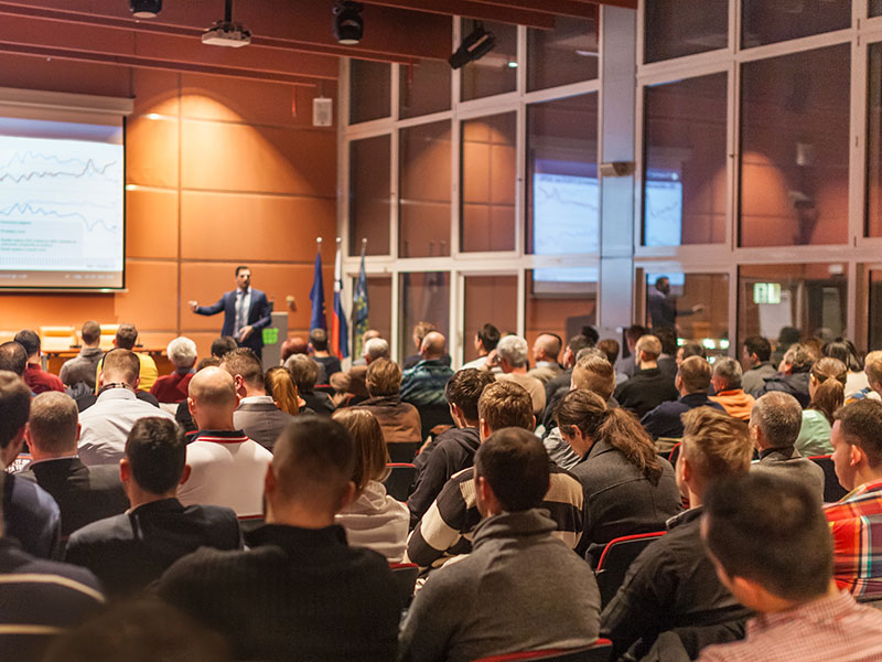 Business speaker giving a talk in conference hall