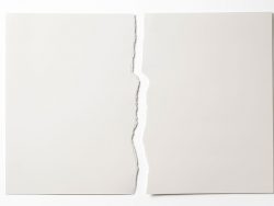 Isolated shot of torn white paper on white background