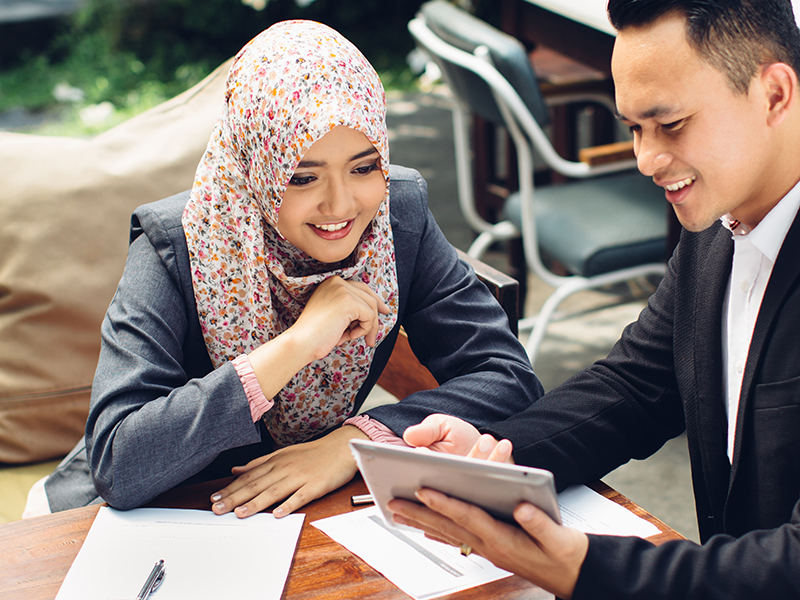 Business adviser analyzing financial figures of the company while meeting