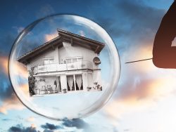 Human Hand Poking House And Bubble With Needle Against Cloudy Sky