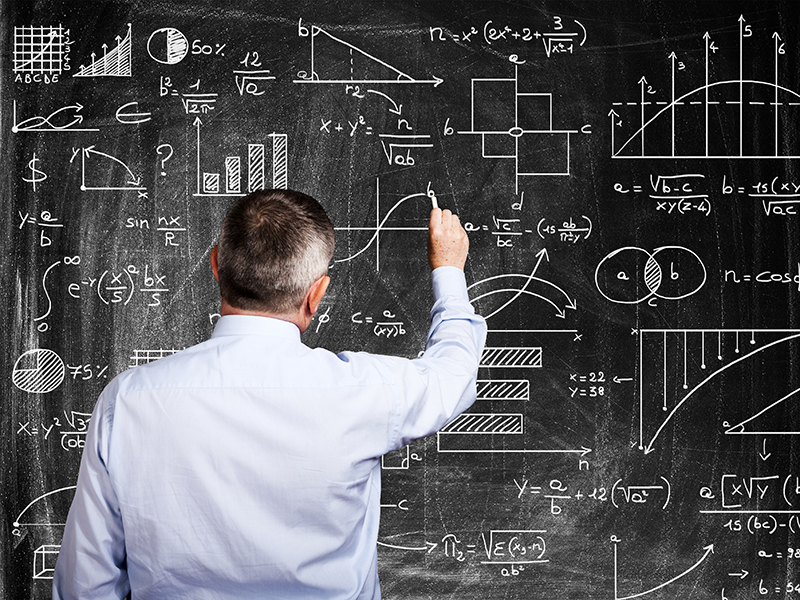 Man writing on a blackboard