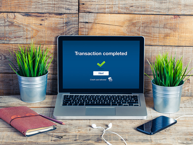 Transaction completed message in a laptop computer, at the office.