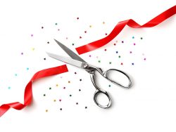 grand opening illustrated with a scissors, a red ribbon and confetti on a white background