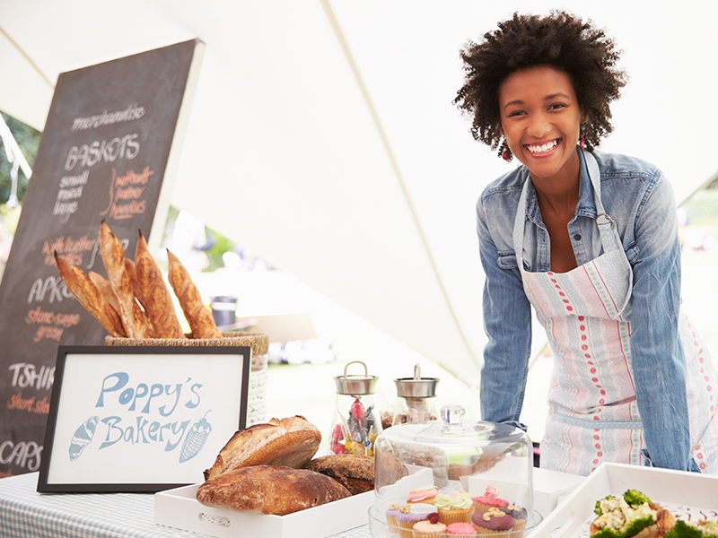 Female Bakery Stall Holder At Farmers Fresh Food Market