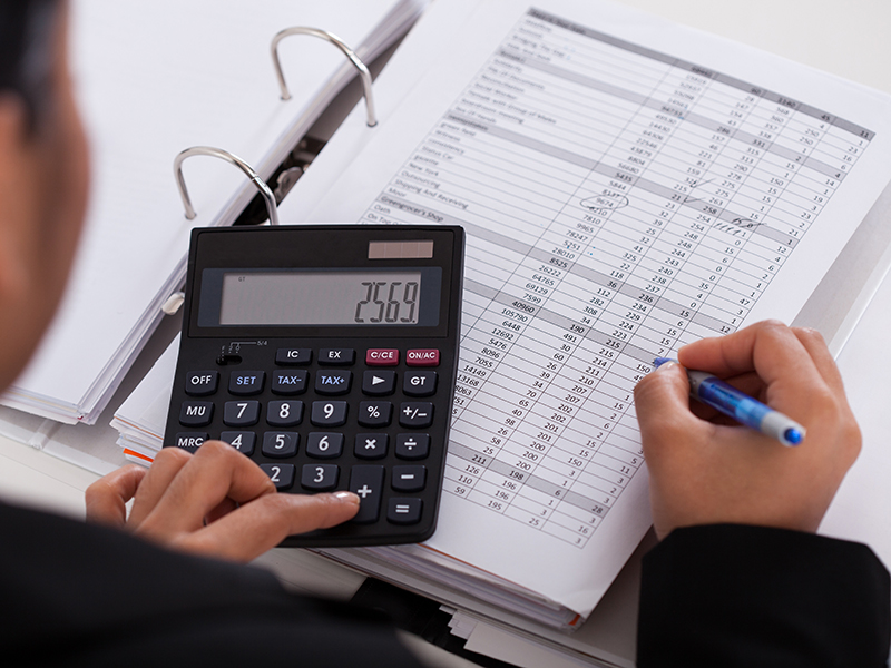 young businesswoman doing calculations in the office