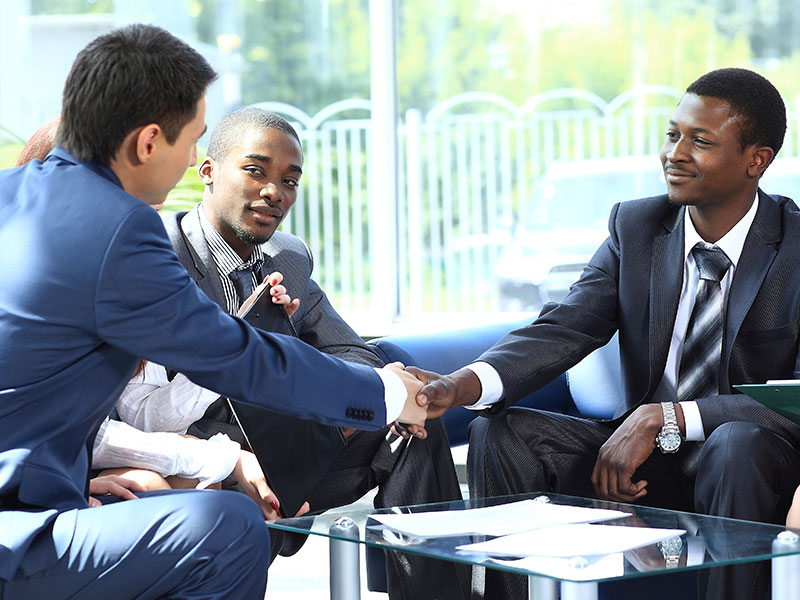 Two business men shaking hands