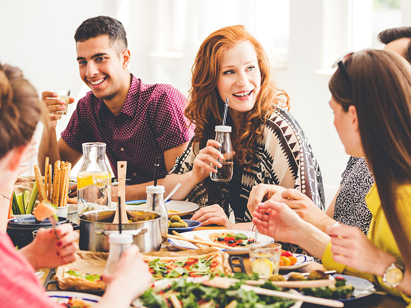 Young people eating vegan food