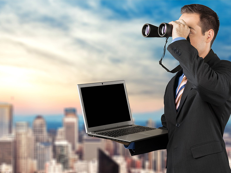 businessman searching with binoculars