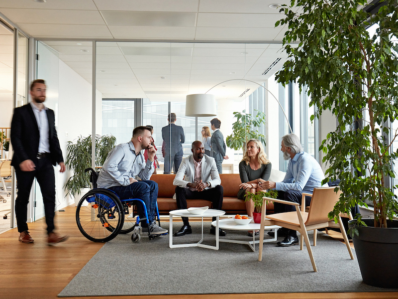 Diverse Executive Team Meeting in Office Reception Room