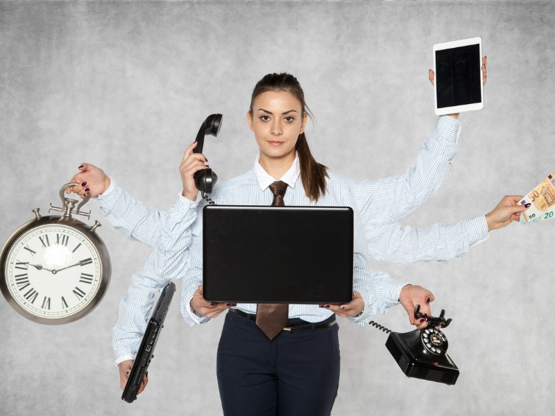 Modern businesswoman replaces several people at once stock photo